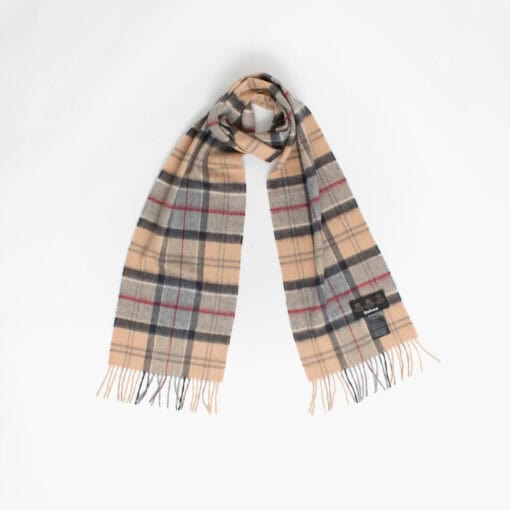 A beige tartan scarf with fringed ends is laid out against a plain white background