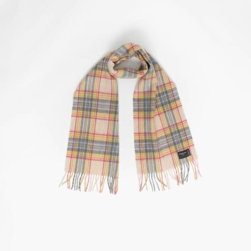 A plaid scarf with fringed ends is laid out against a plain white background.