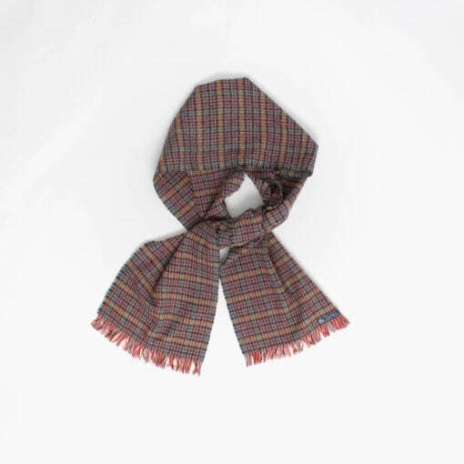 A check scarf with fringed ends is laid out against a plain white background.