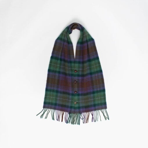 A tartan scarf with fringed ends and button front is laid out against a plain white background.